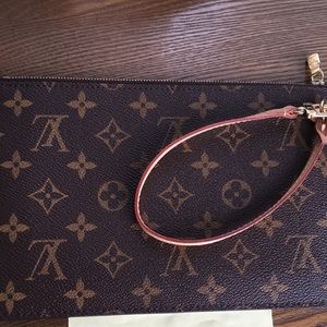 Neverfull GM pouch with beige interior.